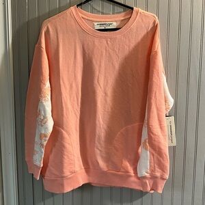 NWT “The Sweatshirt Project” Peach with Floral Sleeves. Big pockets. Cute. New.